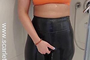 Hey, that hot brunette babe teases in her sports bra and leggings under the shower spray