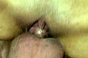 My milf wife spreads her pussy for a detailed close-up view in the bedroom
