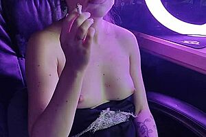 Hey, check out this cute asian lady lighting up a cigarette in a sexy way