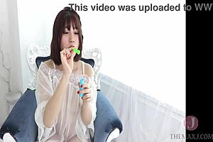 Hey, check out this asian girl seducing in a naughty outfit with feet and boobs 😏