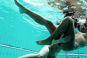 Nataly Gold, that solo teen pornstar, fingers her small tits and pussy casually