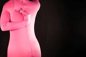 Pink Zentai Housewife Shows Off Natural Tits in Fetish Gear.