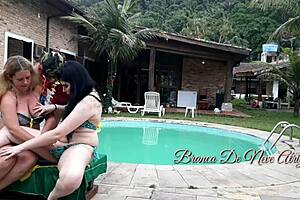 Young Brunette Enjoys Pool Fun with Couple