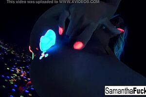samantha saint performs a solo in black light.