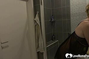 showering woman moans softly during solo bath on camera