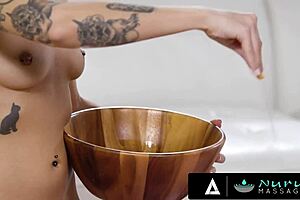 Tattooed masseuse deepthroats client then gets pounded in nuru massage
