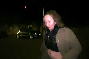 a street girl flashes passersby in the public outdoor area