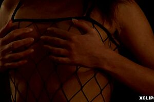 Hey, that filthy but classy babe is fingering herself in fishnets