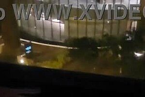 OMG, my girlfriend is fingering her clit in front of the hotel window! 😍