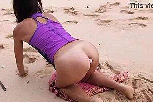 Gloria does no-panties yoga on wild beach with pink butt plug inserted