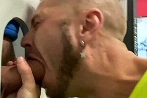 Gay blowjob through glory hole targets massive monster cock