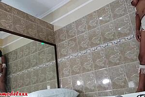 Big tits model poses in tiny costume for photoshoot