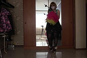 Girl in miniskirt twists juicy ass with anal cork during solo masturbation