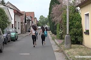 two babes passionately share dildo outdoors