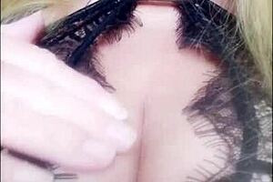 blonde milf teases dildo in blue lingerie on phone