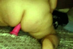 Watch this MILF riding her dildo with toys