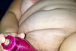 BBW surprise fucked by second dildo while using her other vibrator. She moans loudly on the bed.