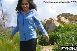 latina milf flashing tits and ass in public outdoor scene.