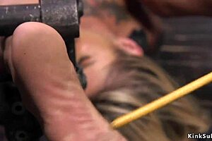 Busty blonde slave tied up and roughly tormented in bondage