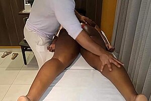 Therapist removes client's panties during tantric massage session