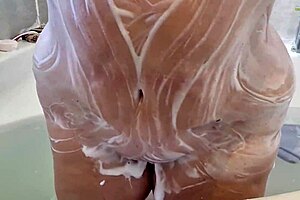 Milf soaping her tits and ass in bath, wow!