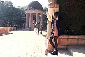 Why is she getting naked outdoors in barcelona's public park?
