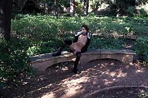 Why is she getting naked outdoors in barcelona's public park?