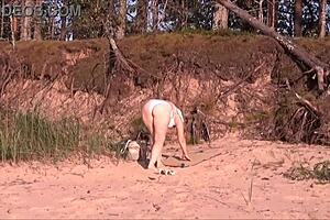 Juicy milf with a big ass in a white bikini