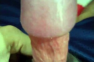 Young amateur giving handjob while masturbating at midnight in homemade video