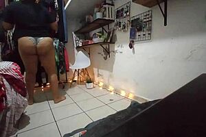 Curvy Mexican brunette bends over folding clothes in revealing thong, caught on hidden camera