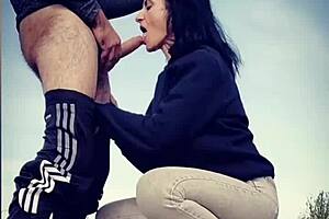 She gives a blowjob then bends over for doggystyle on the road.