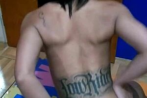 brunette tattooed girl sits on the console topless for the first time in a sensual way