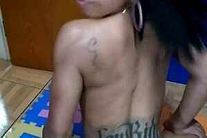 brunette tattooed girl sits on the console topless for the first time in a sensual way