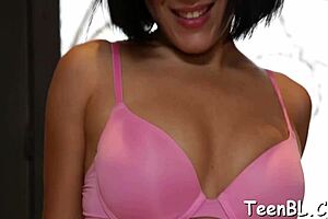 She licks the guy's penis and balls while he masturbates close up.