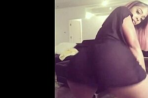 african girl in dress twerks expertly on the dance floor.