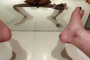 Chinese ladyboy reaches intense climax while stroking in front of mirror