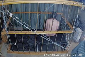 Intense cage bondage for gay slave, bound tightly in the cage