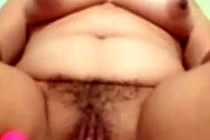 Look at that horny milf masturbating her big tits and ass!