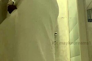 Ebony Guy Shaves in Bathroom