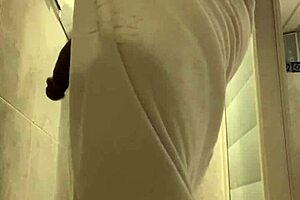 Ebony Guy Shaves in Bathroom