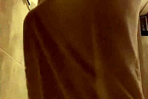 Ebony Guy Shaves in Bathroom