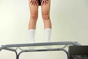 The girl says, 'watch me crush this banana with my feet.'