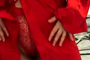 Brunette in red lingerie plays with herself