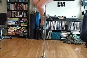 curvy blonde milf teasing on pole with clothes ripped in indie pop strip