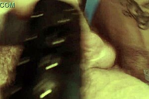 man stretches with machine in leather bondage 😏