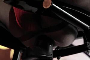 man stretches with machine in leather bondage 😏