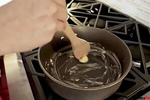 stepmom gives blowjob to stepson while he's cooking