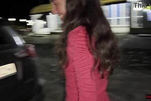 two cute girlfriends sneak a pee by the car in public parking