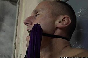 Lingerie model oversees bound participant in subtle control