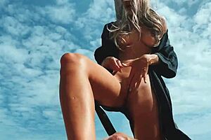 a blonde strokes cock with feet at public nudist beach till cum.